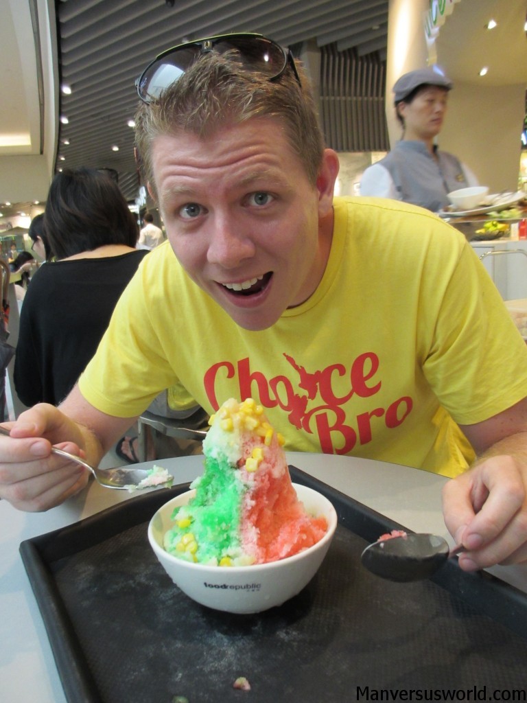 Me eating an Ice Kacheng dessert in Singapore