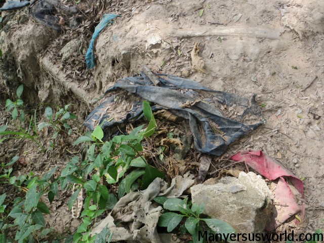 Rags and remains litter the ground at the killing fields of Choeung Ek.