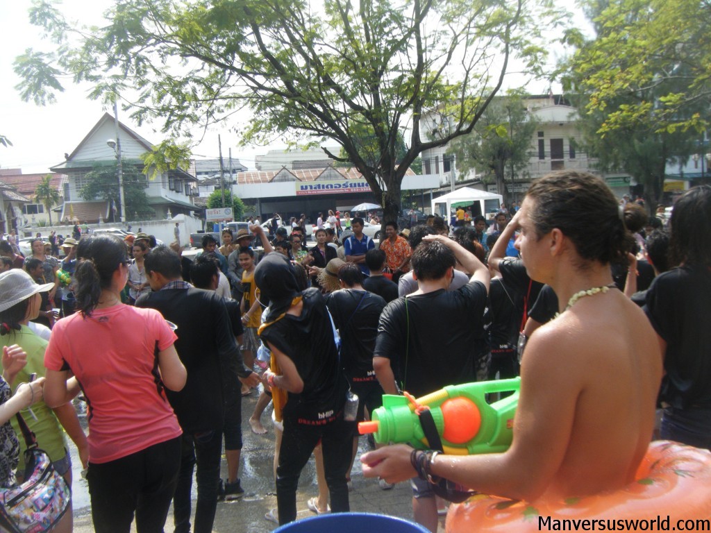 People dance on the street during Songkran in Chiang Mai