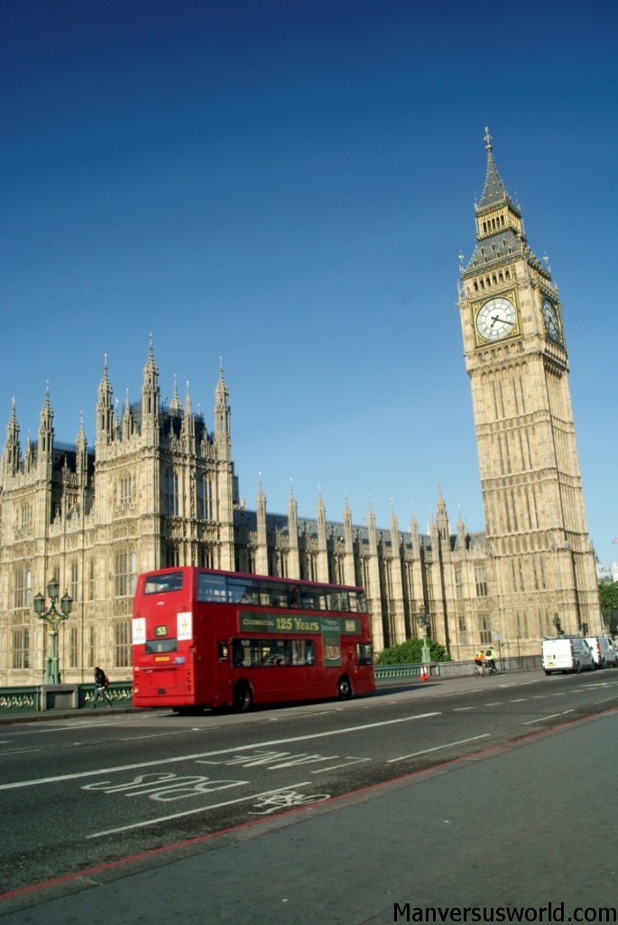 London bus drives past Big Ben