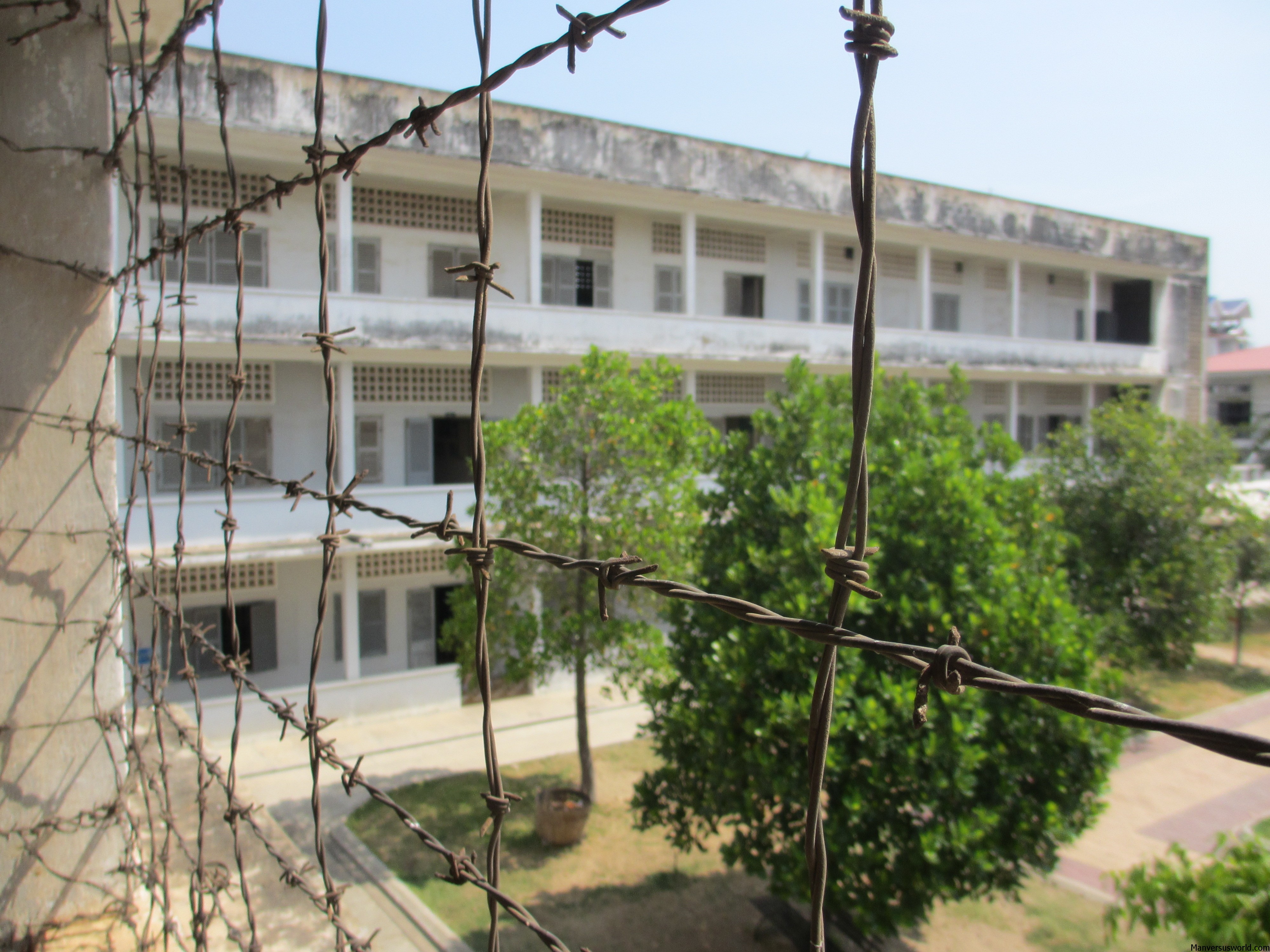 The view through barbed-wire of former Khmer Rouge torture facility S-21