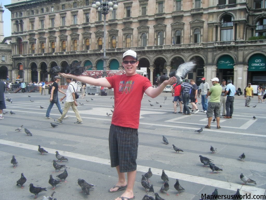 Feeding the pigeons in Milan’s Piazza del Duomo
