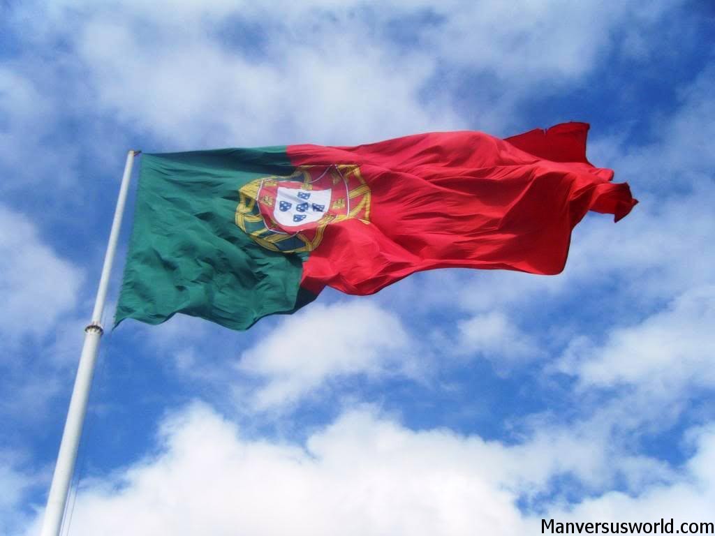 The flag of Portugal flies high above Lisbon
