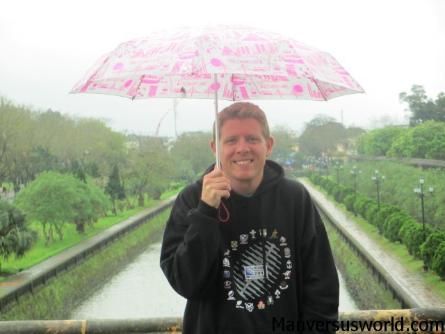 Me with an umbrella at Hue's Imperial City