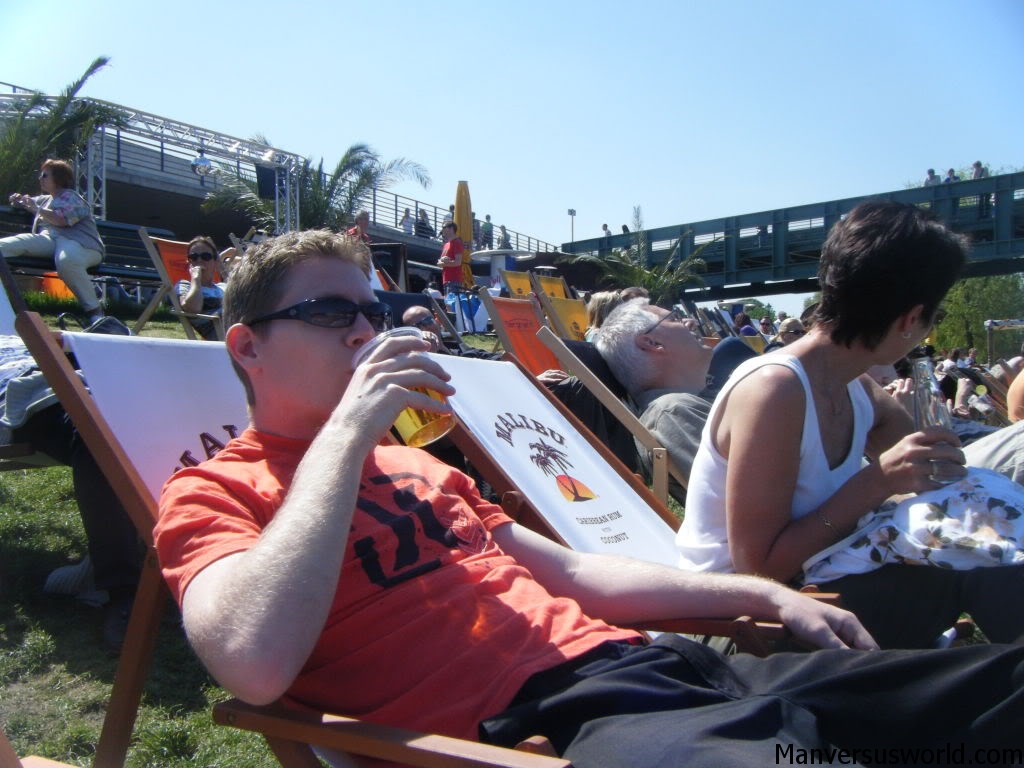 Sitting on a beachchair in Berlin, drinking by the Spree