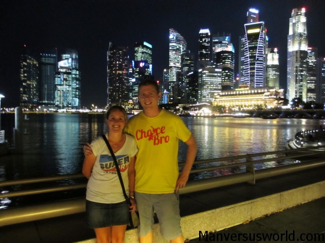 Me and Nic in front of the Singapore skyline at night